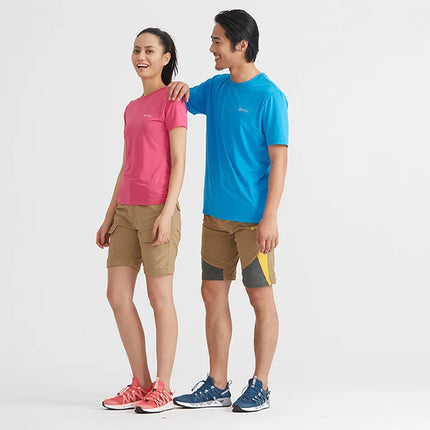 Two people wearing casual outdoor clothing and water shoes, showcasing HydroFlow Aqua Upstream shoes in pink and blue.